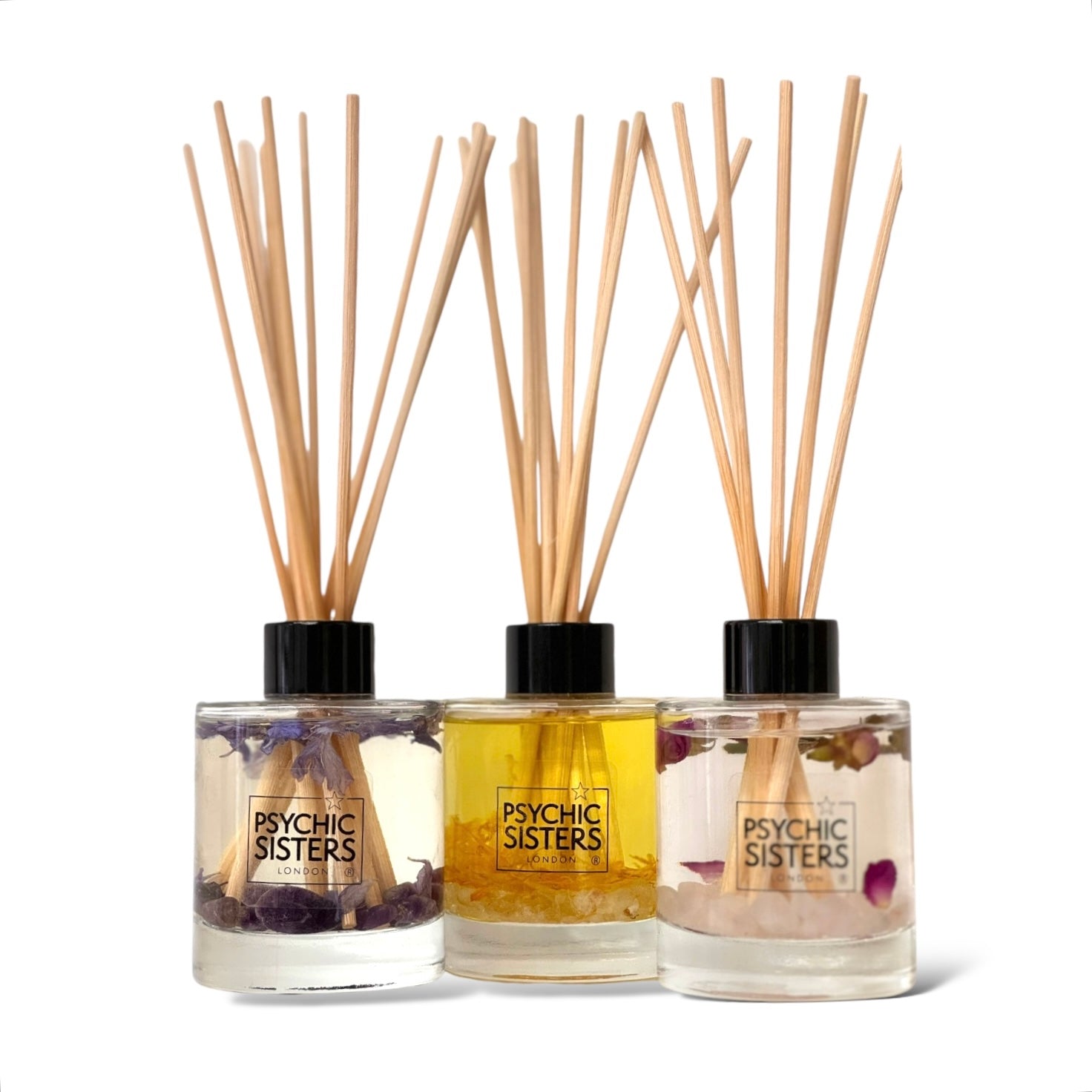 Gemstone infused reed diffuser trio from Psychic Sisters, featuring calming fragrances and beautiful design.