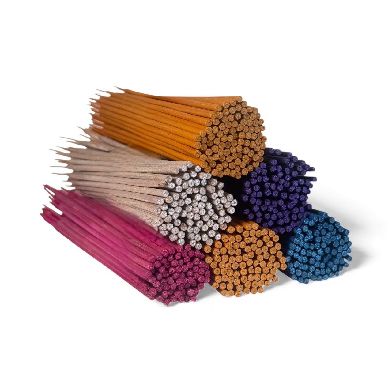 Collection of aromatic incense sticks in colorful tubes, ideal for enhancing relaxation and meditation.