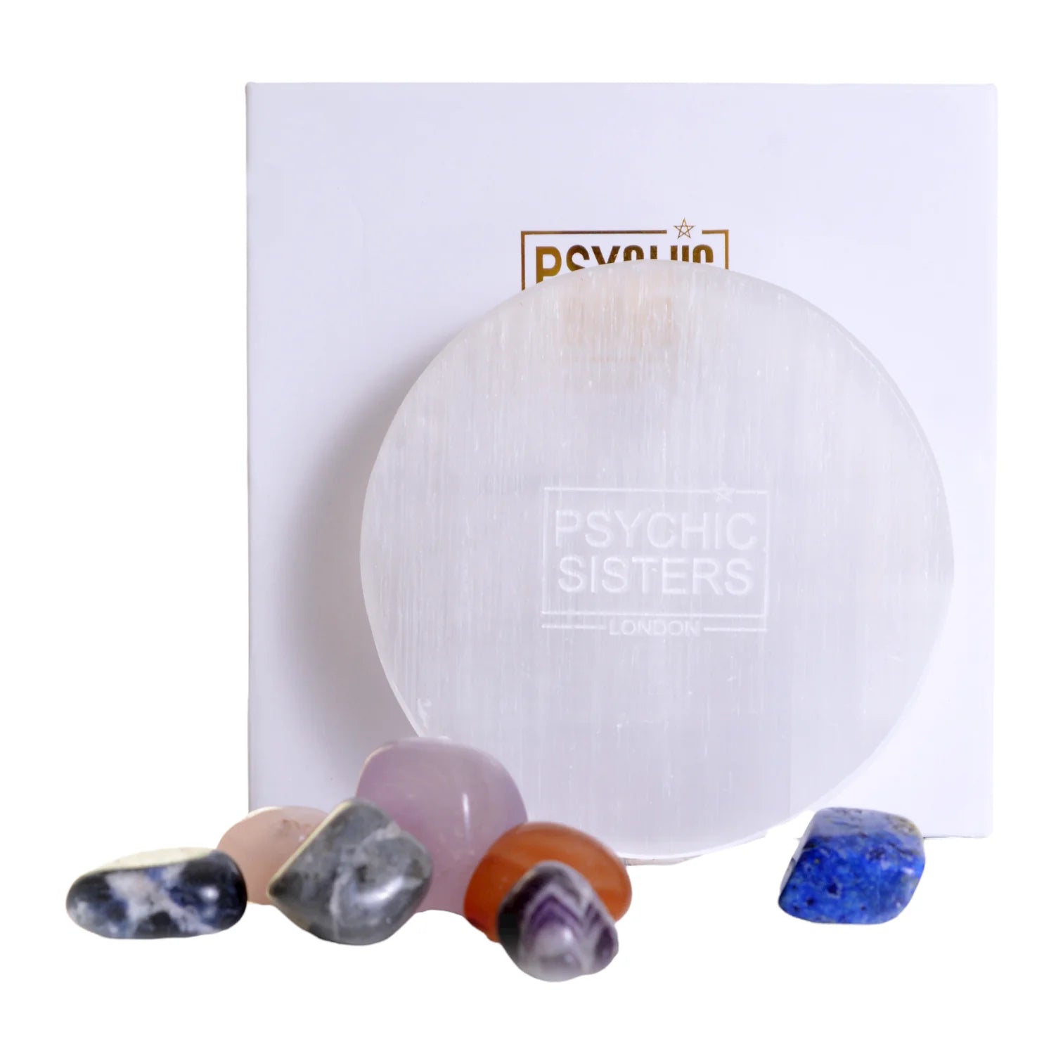 Selenite charging plate from Psychic Sisters with an array of colorful gemstones for energy cleansing.