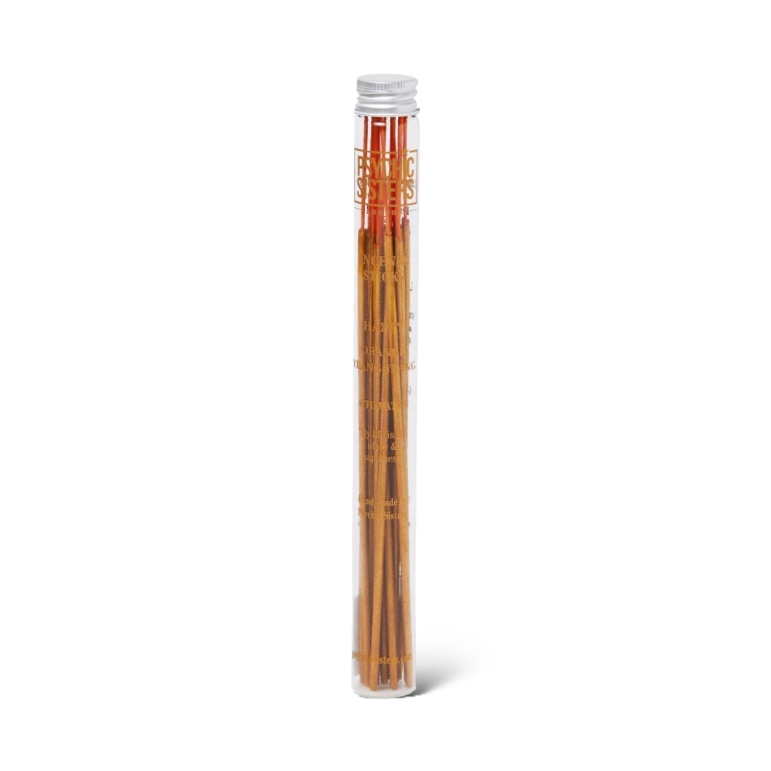 A set of brown incense sticks displayed vertically in a clear glass holder with a white top.