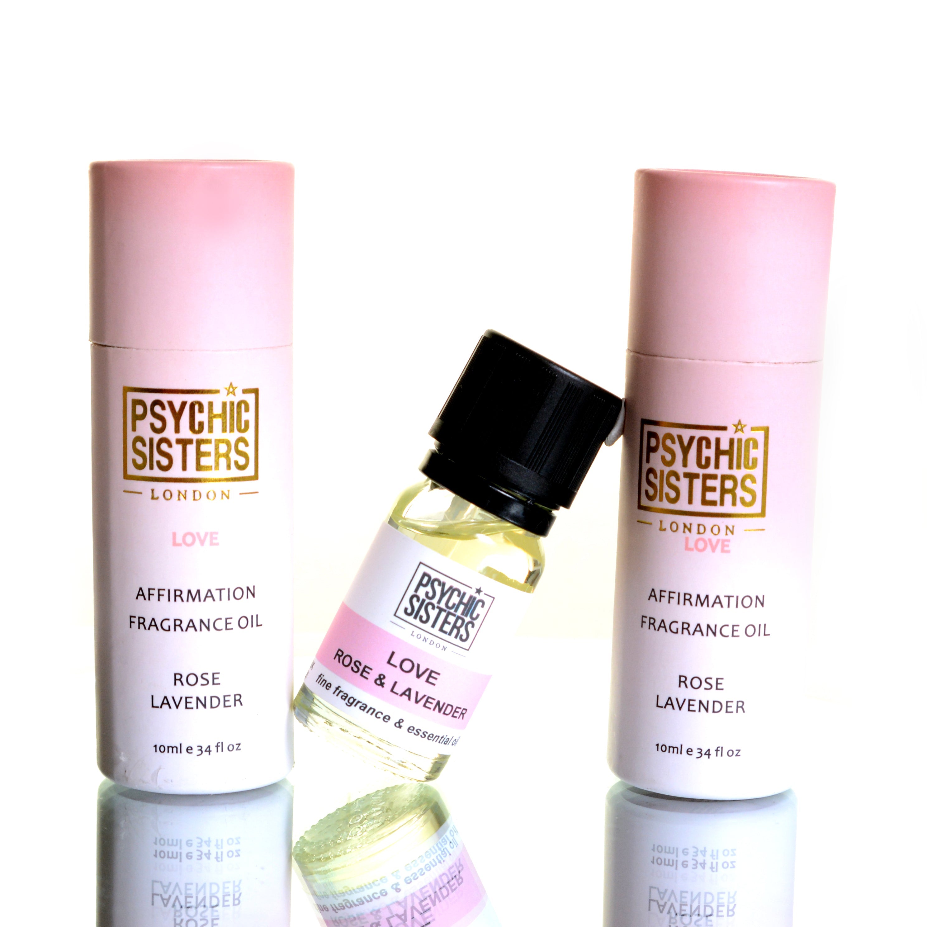 LOVE OIL by Psychic Sisters - Rose and Lavender affirmation fragrance oils in pink packaging.