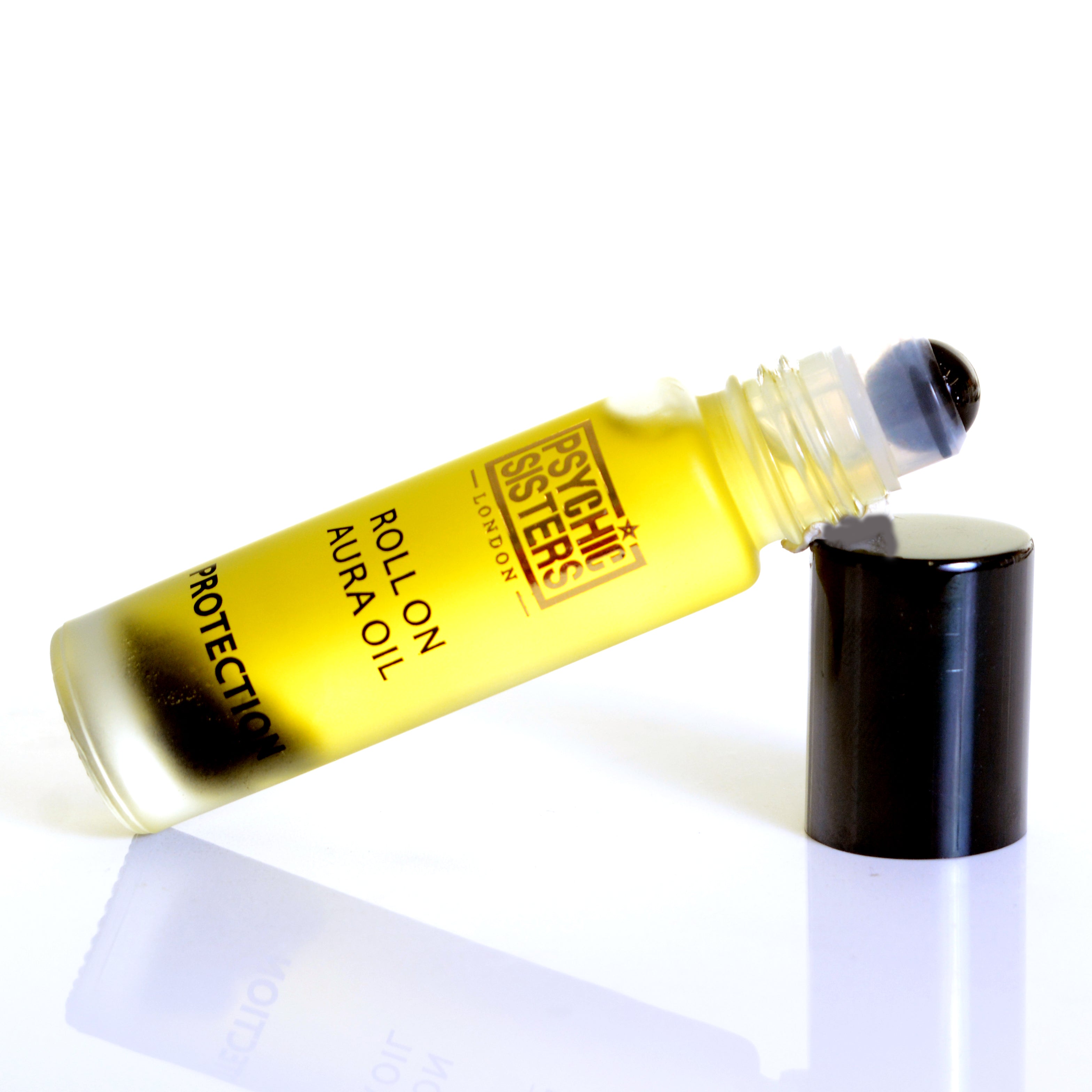 Protection Roll On from Psychic Sisters, a blend of essential oils and gemstones in a roller bottle.