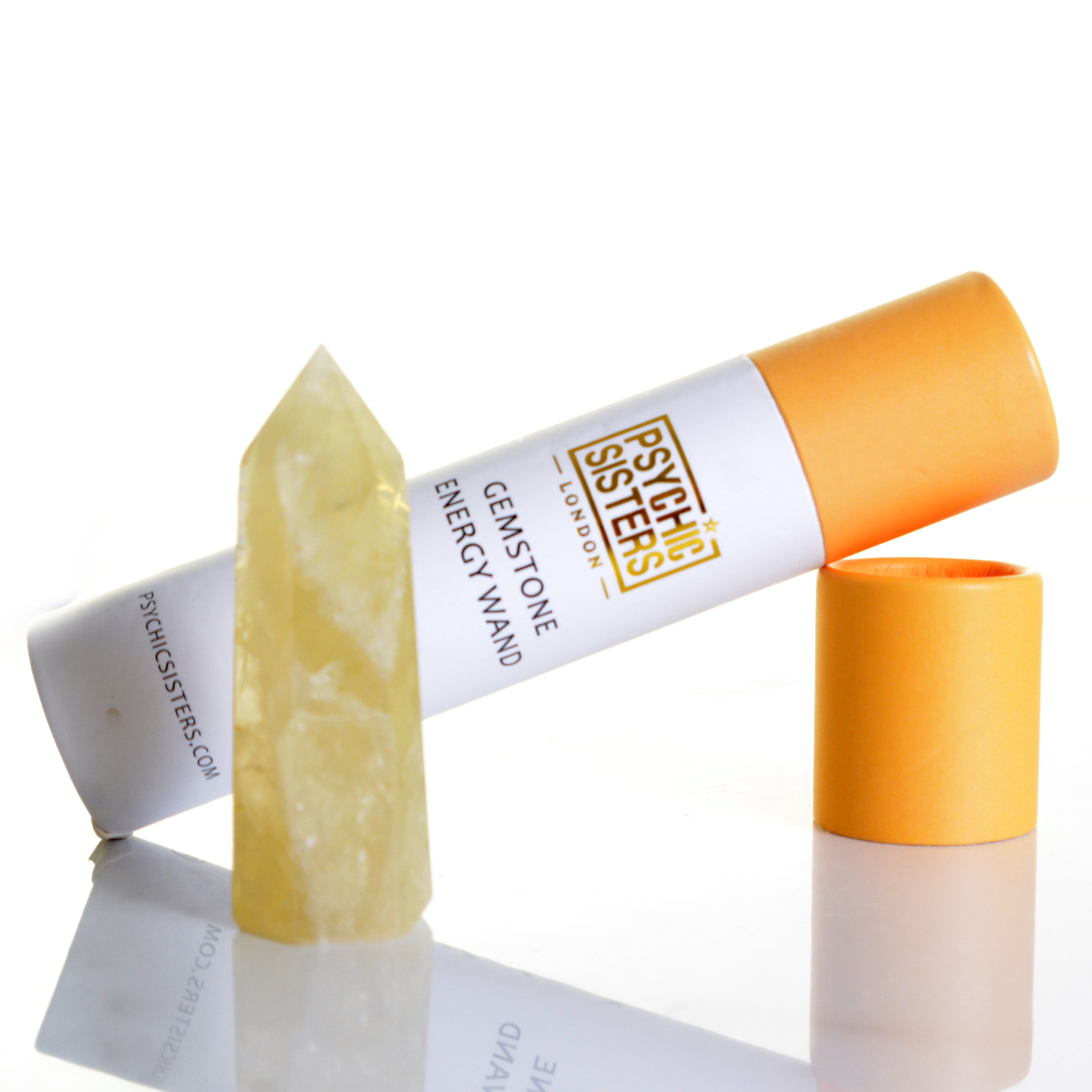 Citrine Point gemstone energy wand beside its packaging, promoting prosperity and abundance.