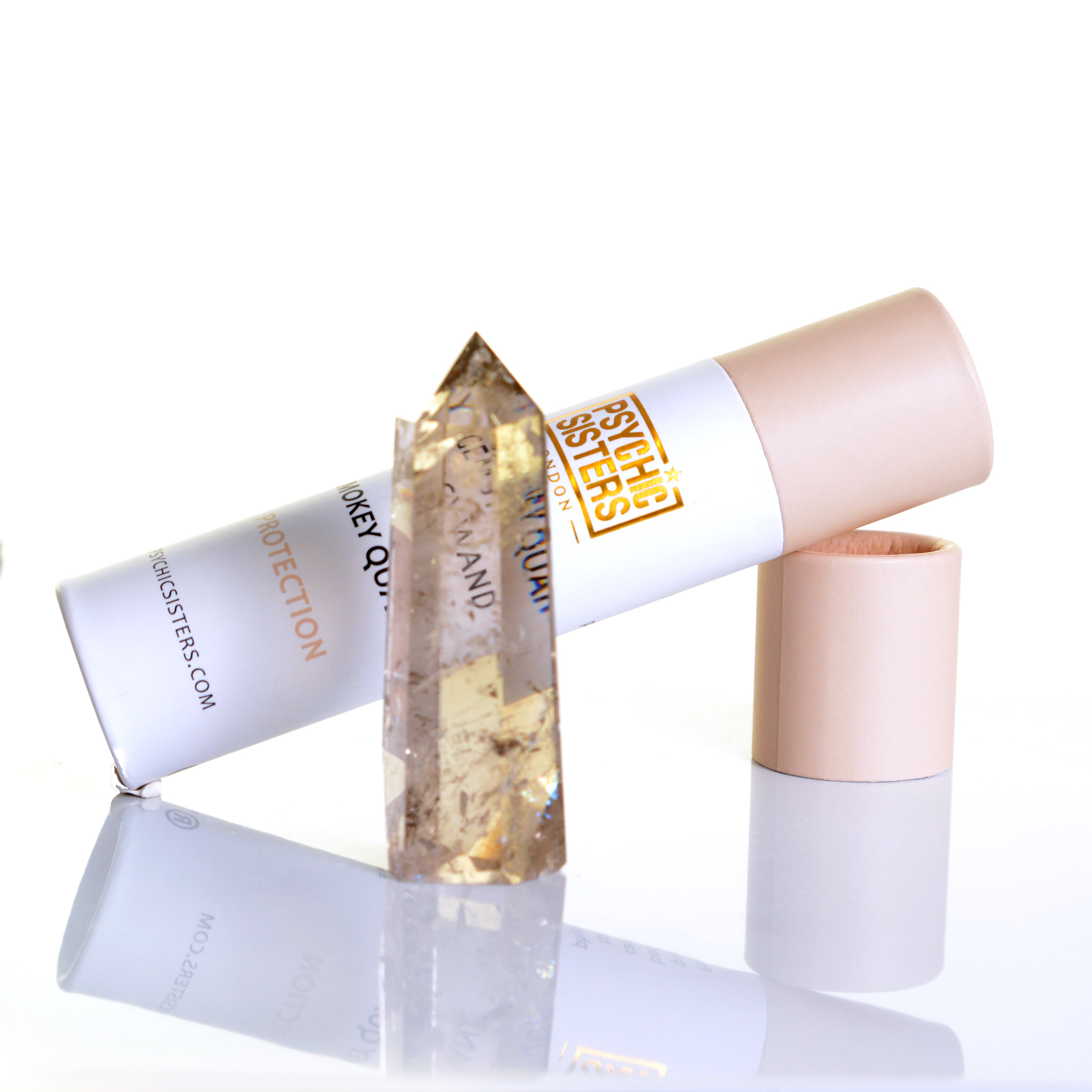 Smokey Quartz Point displayed with packaging, showcasing its natural beauty and protection properties.