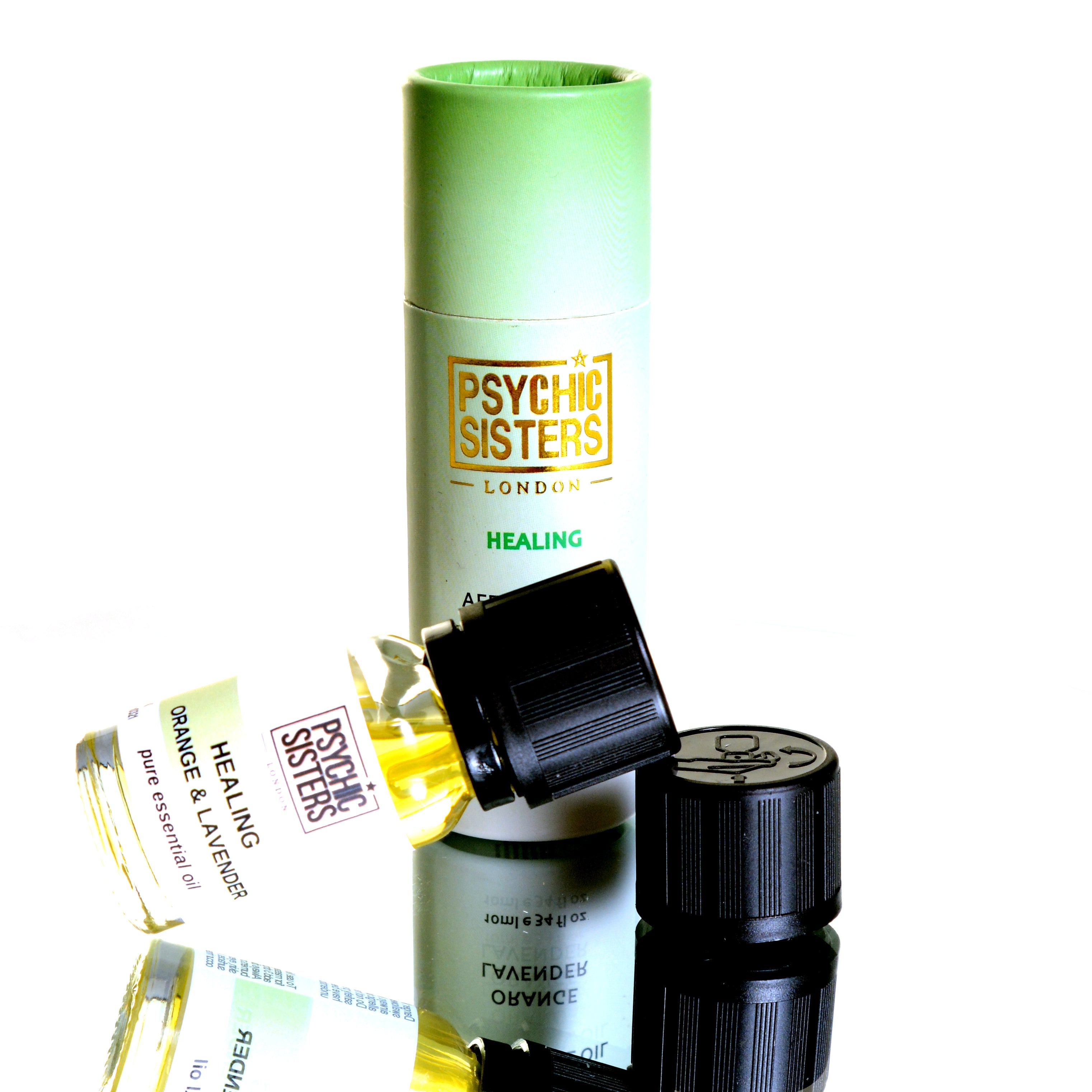 Psychic Sisters Healing fragrance oil bottle with cap and packaging, hand-blended and Reiki charged.