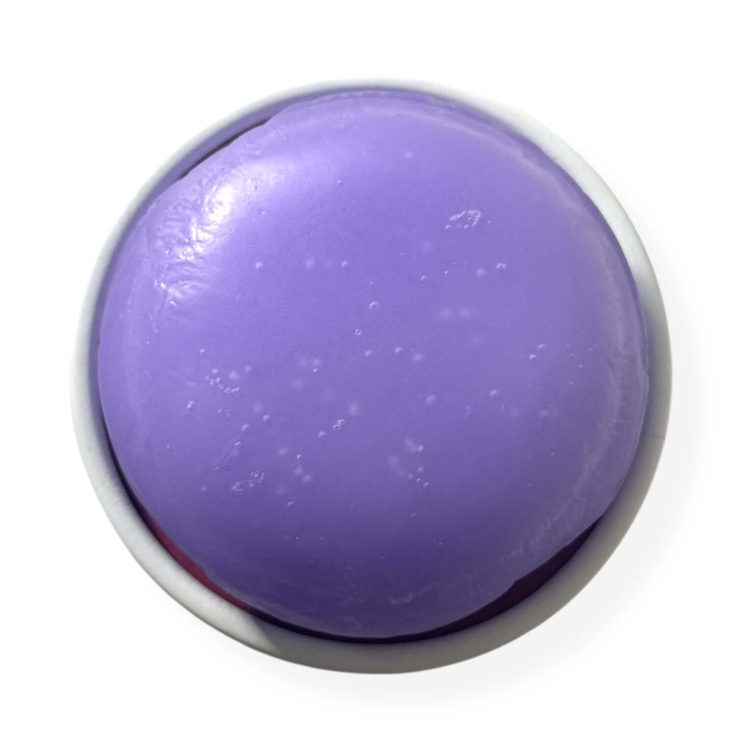 Rosemary biotin conditioner bar in circular shape, featuring a smooth lavender surface and hidden Amethyst gemstone heart.