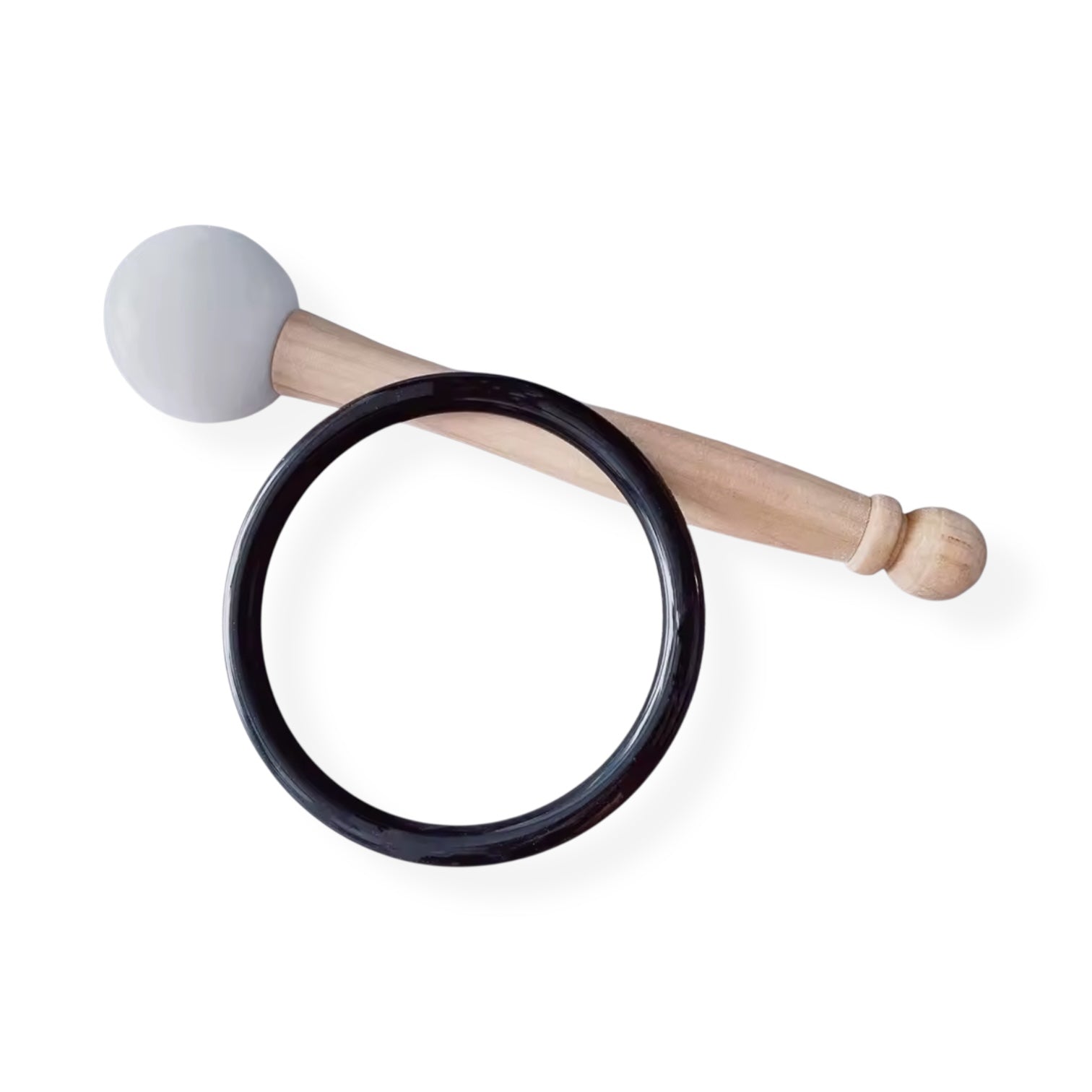 Singing bowl mallet and black rubber ring used for playing a singing bowl.