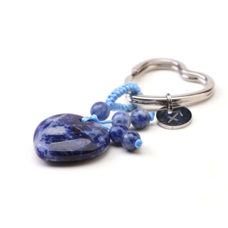 Keychain with blue stone heart and beads on a white background