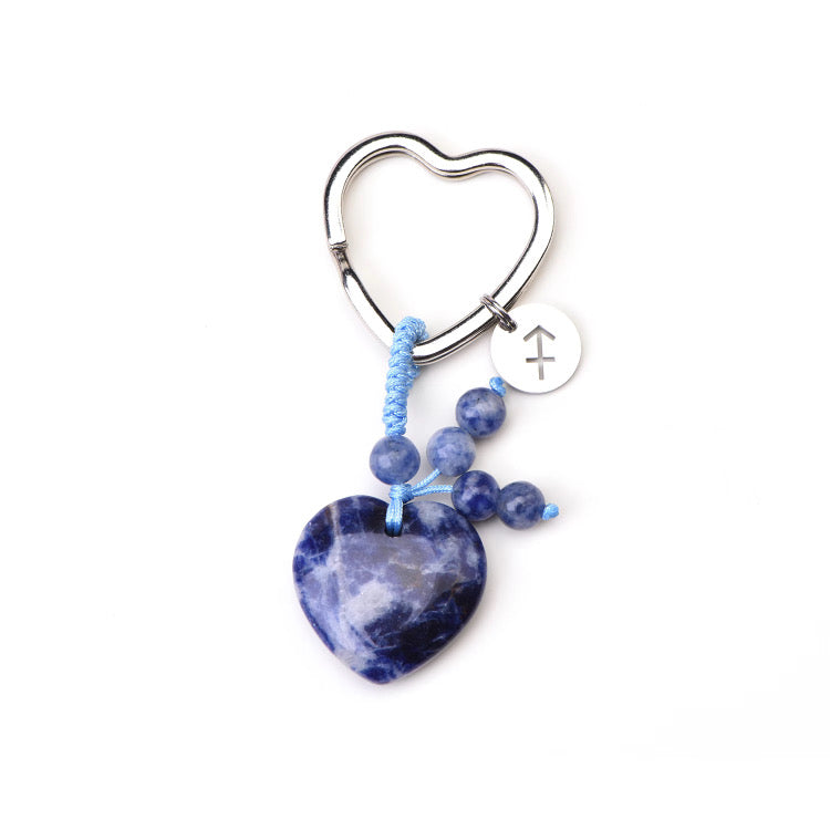 Psychic Sisters Heart-shaped keychain with blue Soderlite Zodiac Birthstone beads on a white background