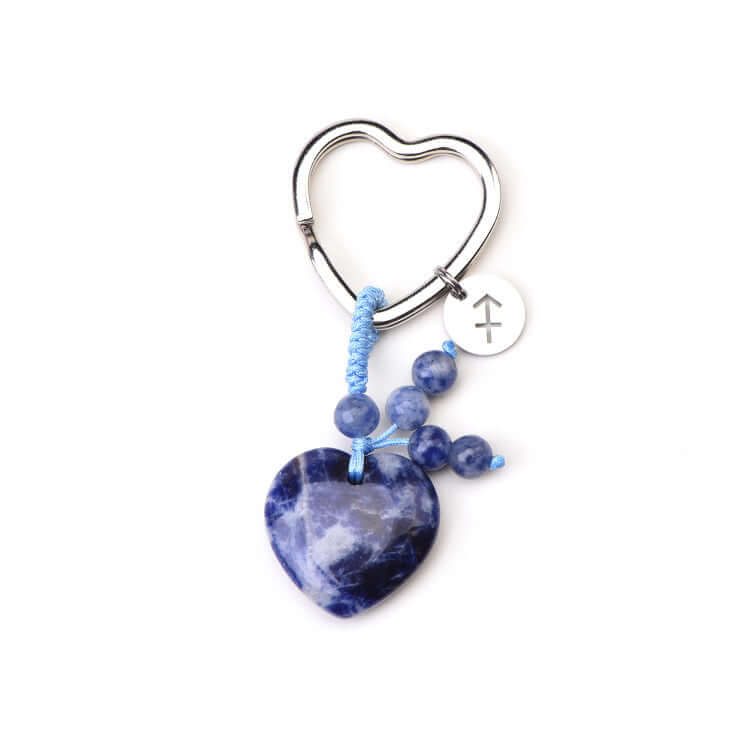 Psychic Sisters Heart-shaped keychain with blue Soderlite Zodiac Birthstone beads on a white background
