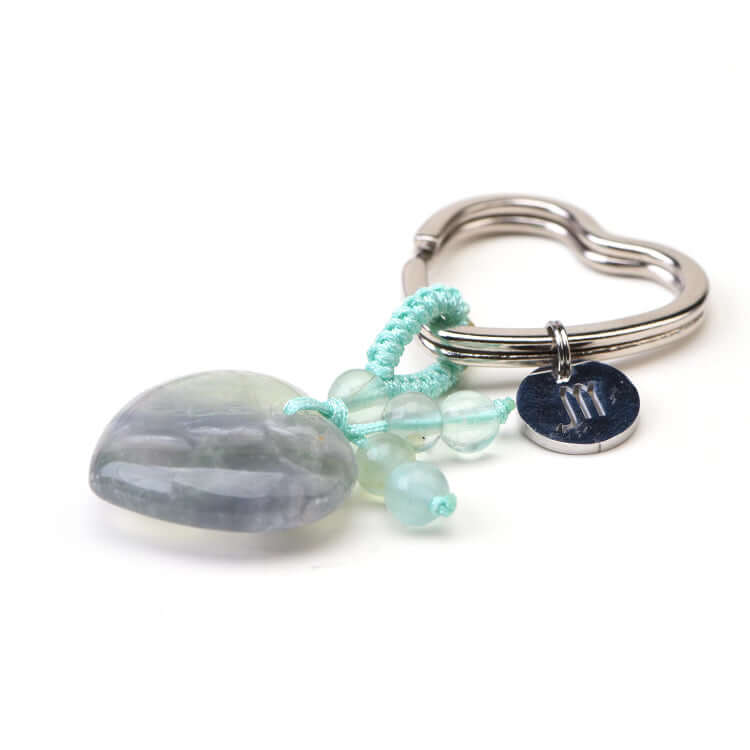 Keychain with beads and a heart-shaped charm on a white background