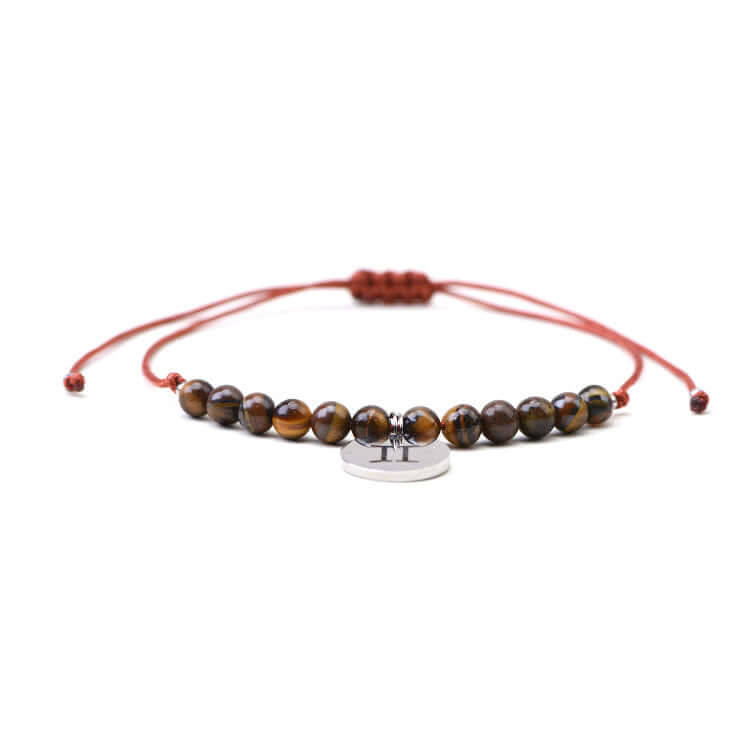 Gemini Tigers Eye Bracelet featuring brown tiger's eye beads and zodiac charm for clarity and focus.
