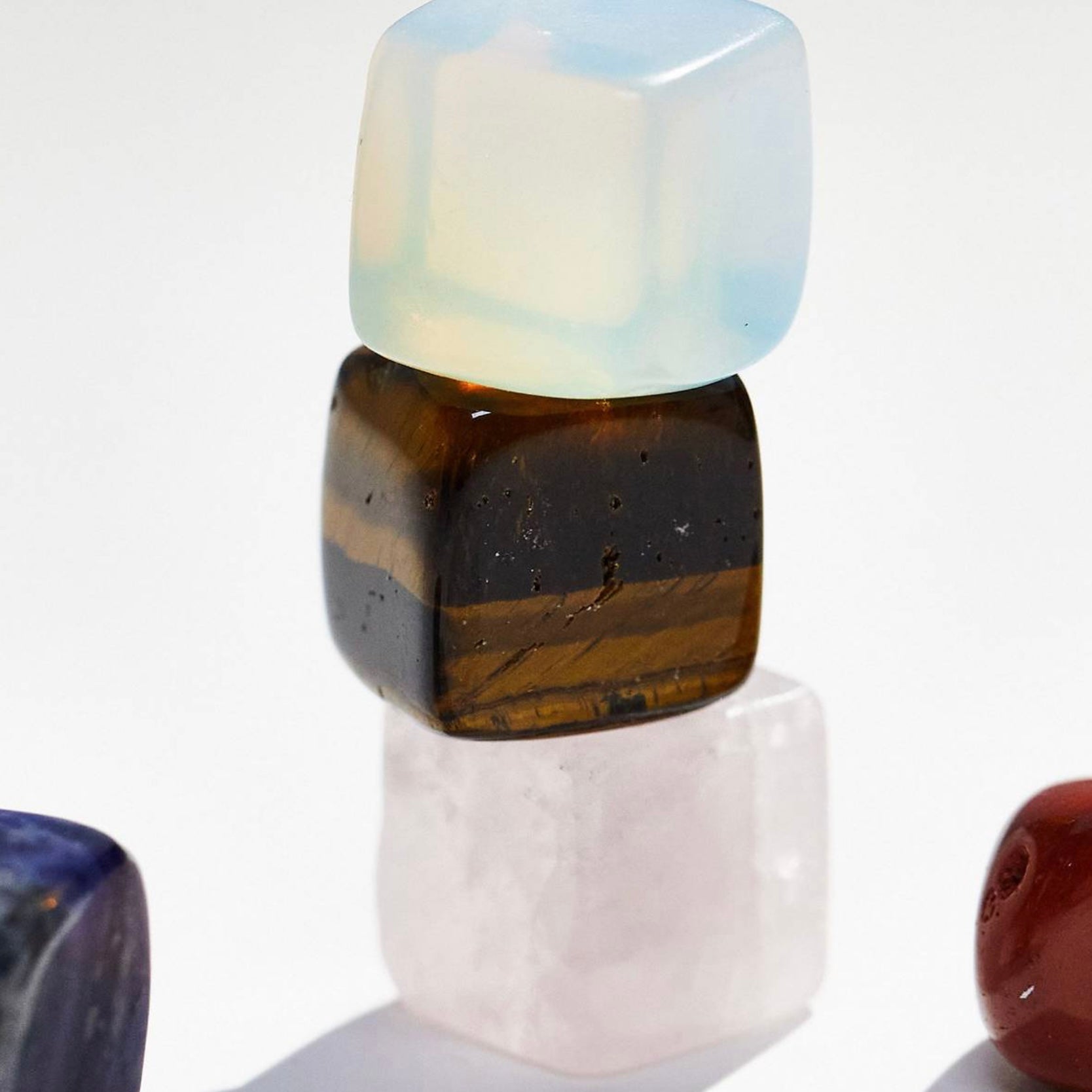 Gemini Crystal Set featuring stacked colorful crystals including opal, tiger's eye, and rose quartz.