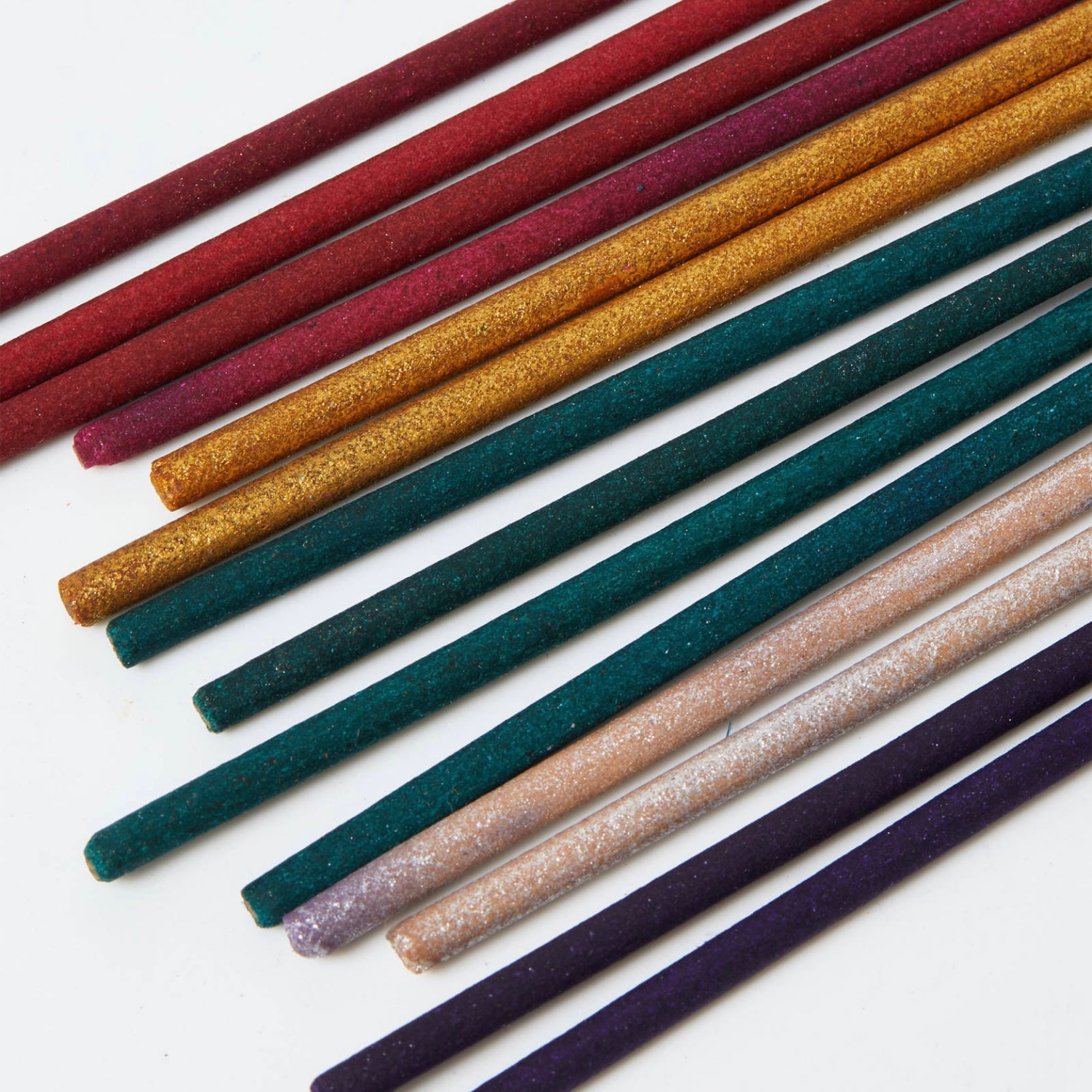 Mixed Incense sticks in various colors including red, green, gold, and purple, showcasing the luxury handmade quality.