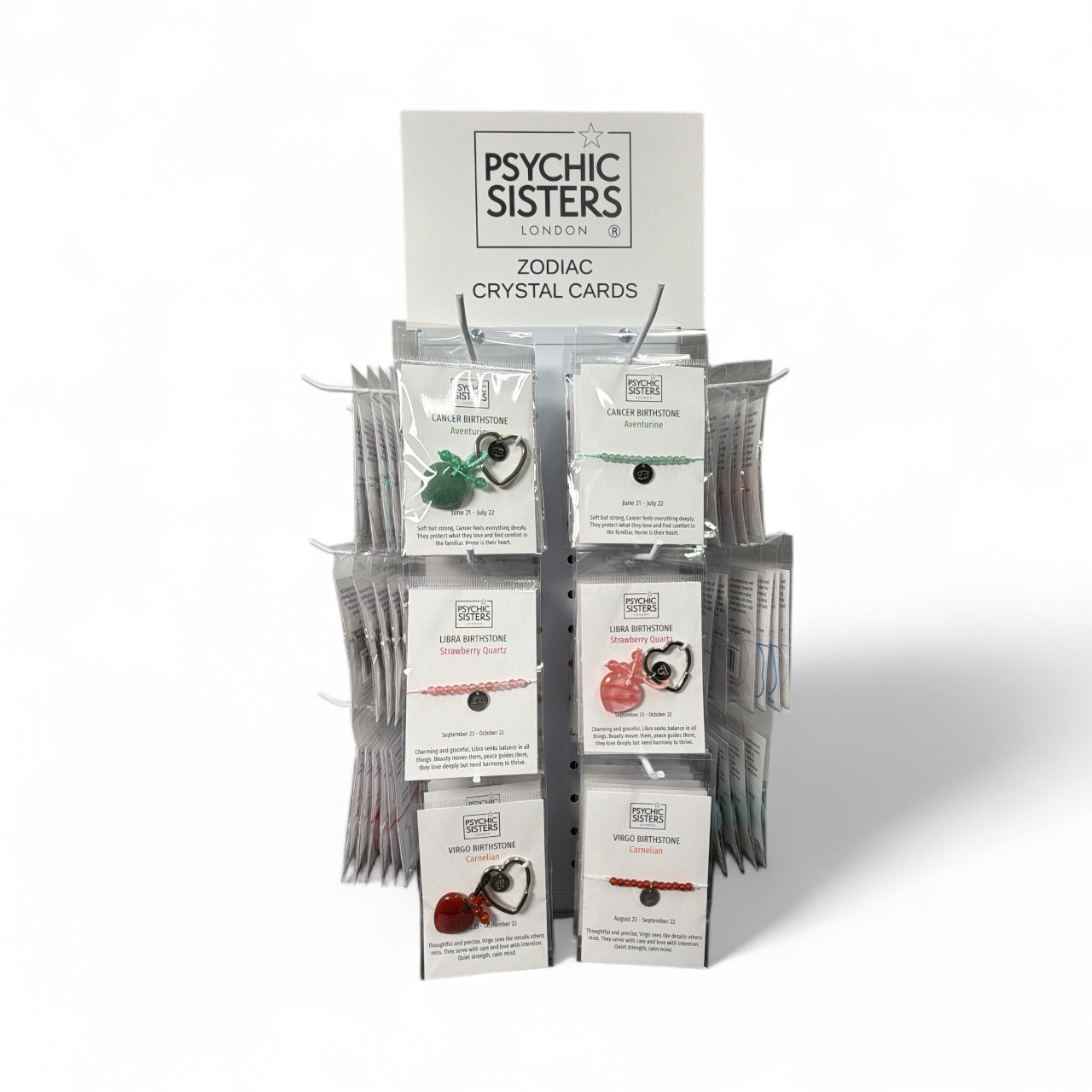 Display of Handmade Zodiac Gemstone Key Ring Set by Psychic Sisters showcasing various gemstone cards.