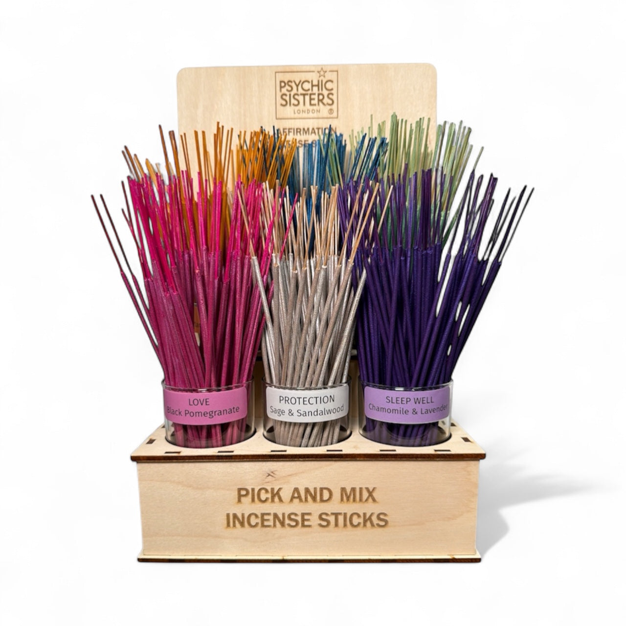 Psychic Sisters incense stick set displayed with colorful scents for calm and clarity in a wooden stand.