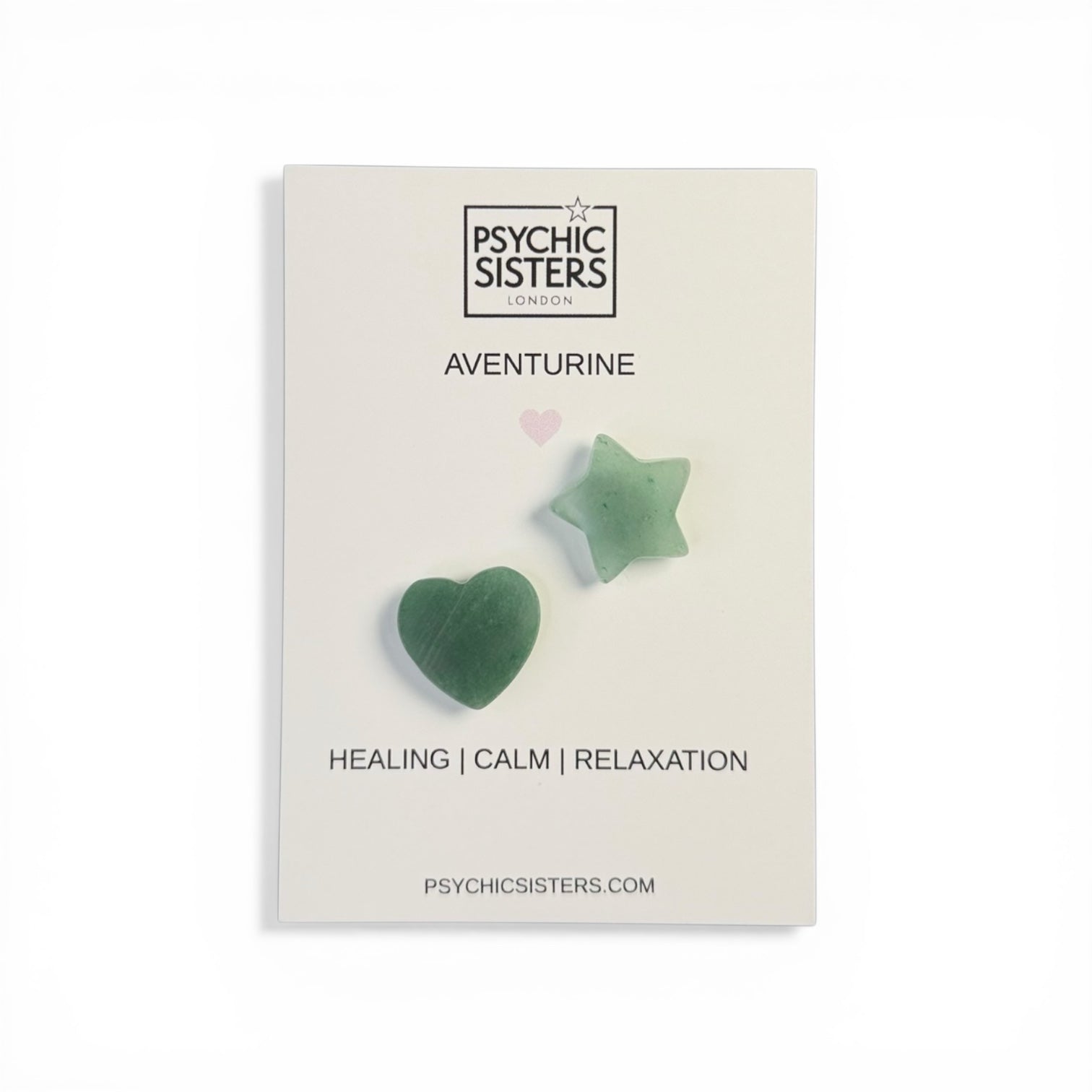 Heart-shaped aventurine stones on a Psychic Sisters branded card with text about properties and website.