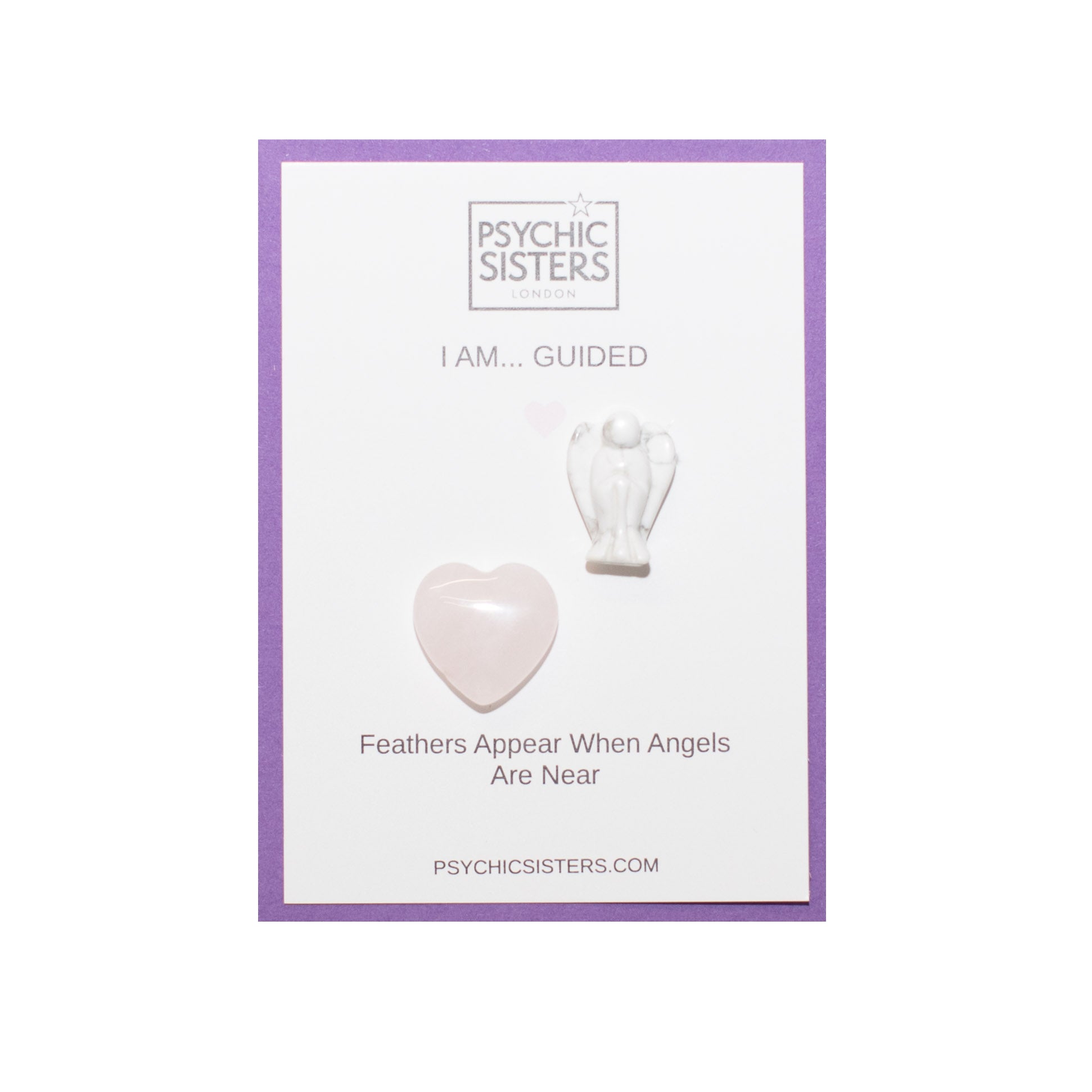 I Am Guided Hand-Chosen Crystal Card featuring heart and angel figurine gemstones.