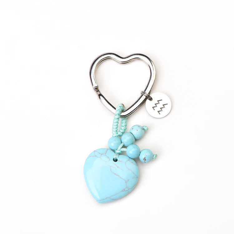 Psychic Sisters Aquarius zodiac keyring with a heart-shaped turquoise crystal, silver symbol disk, and matching beads.