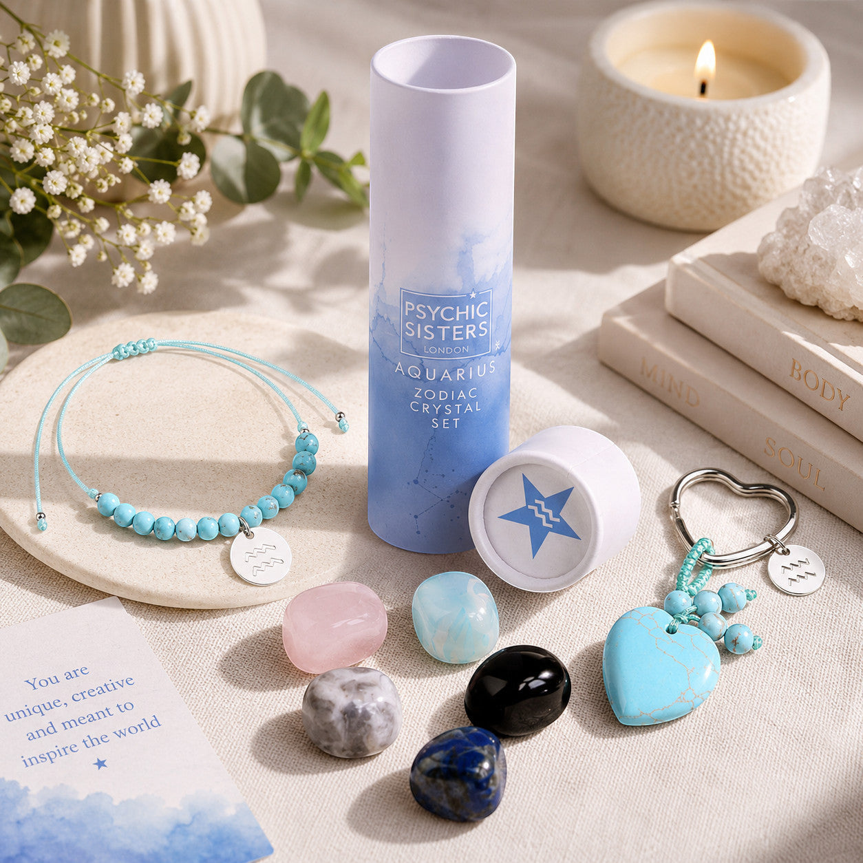 Psychic Sisters Aquarius zodiac gift set with crystal stones, beaded bracelet, and heart keyring in a gift tube.
