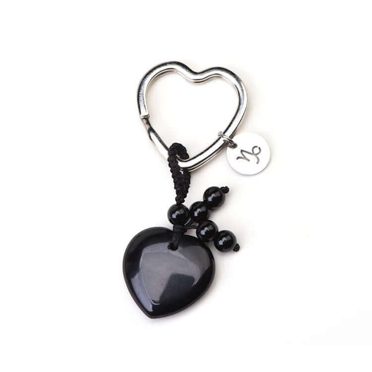 Psychic Sisters Capricorn zodiac keyring with a black heart crystal, sterling silver symbol disk, and black beads.