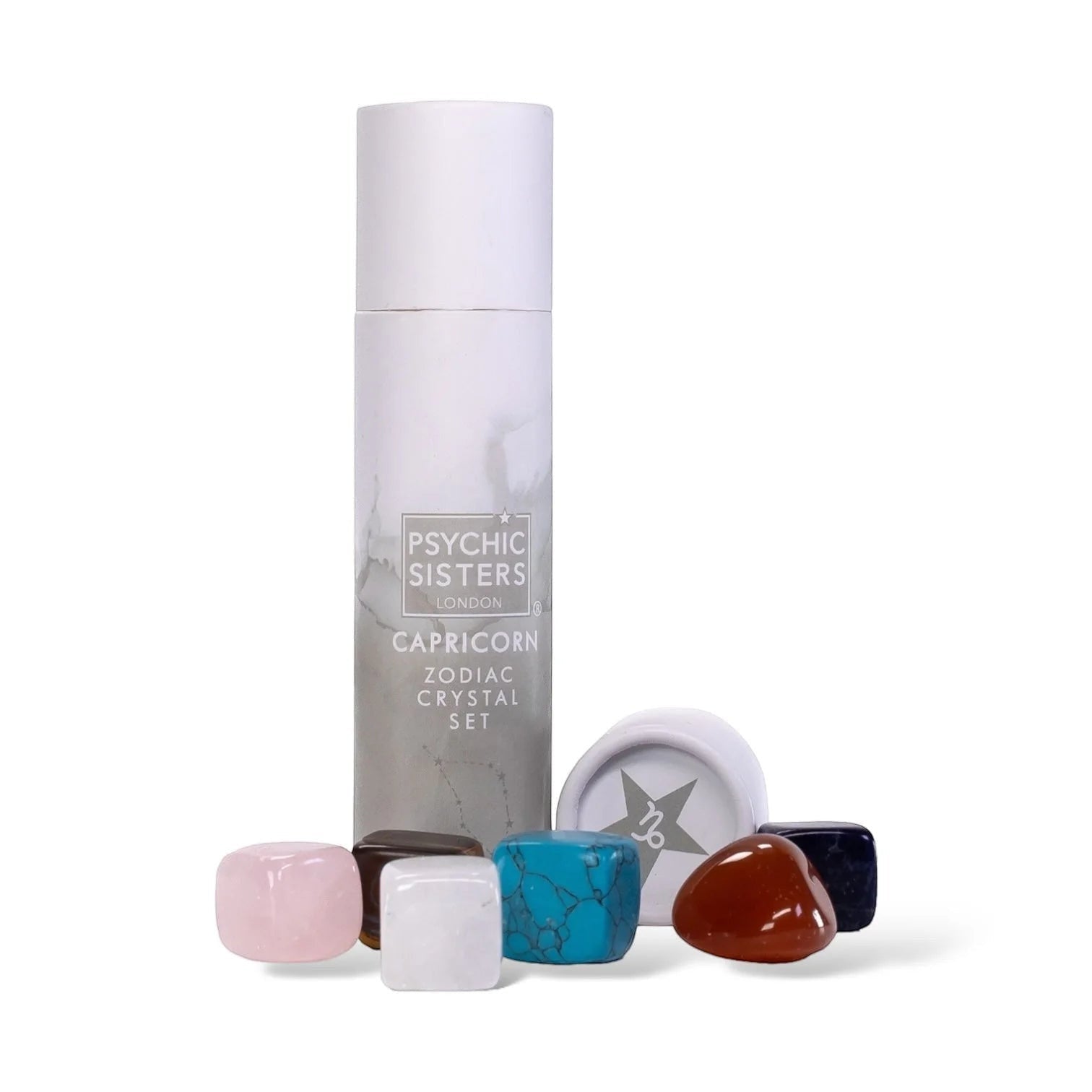 Psychic Sisters Capricorn Zodiac Crystal Set with six tumbled gemstones and a white recycled cardboard gift tube.
