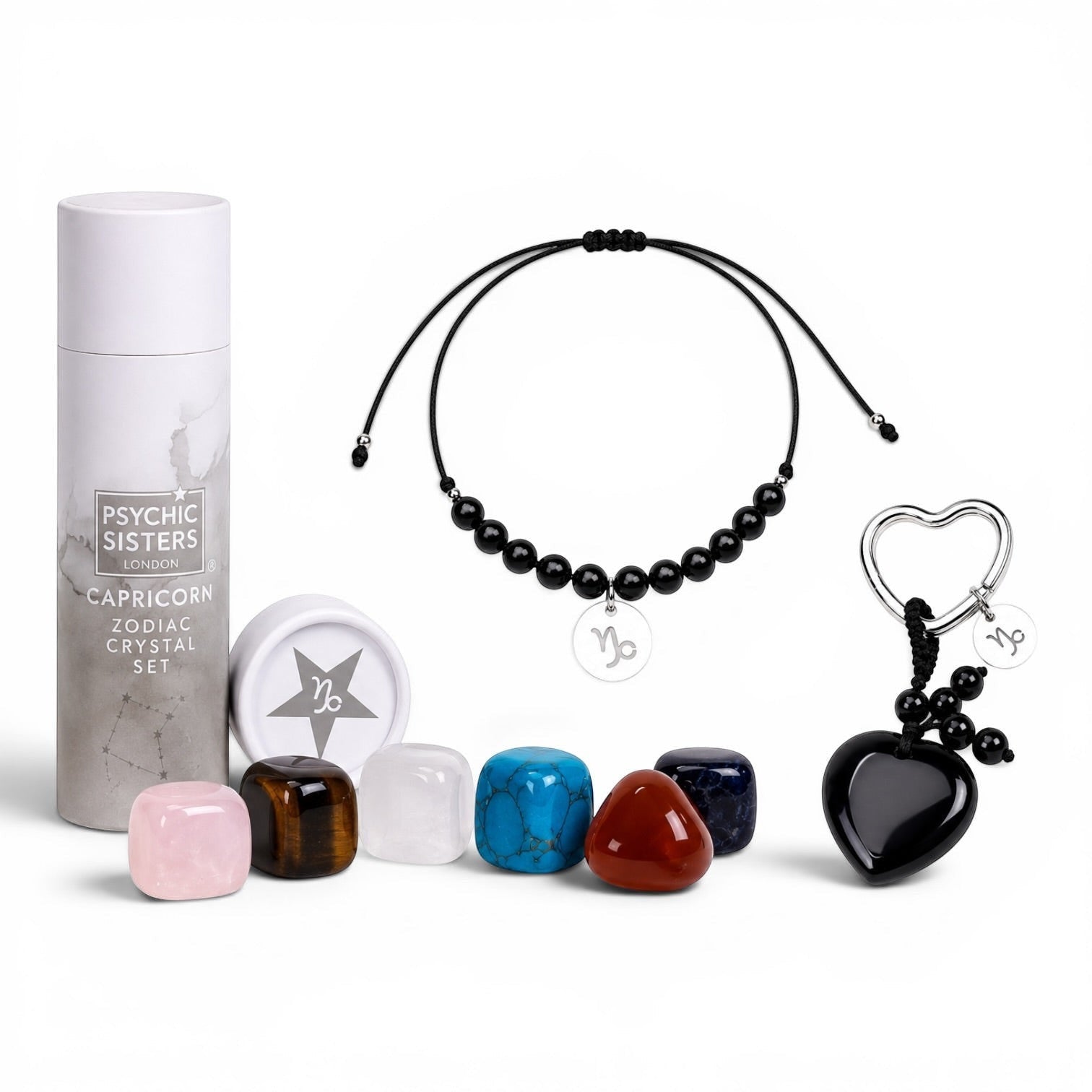 Psychic Sisters Capricorn zodiac gift set with six crystals, a black beaded bracelet, and a heart-shaped keyring.