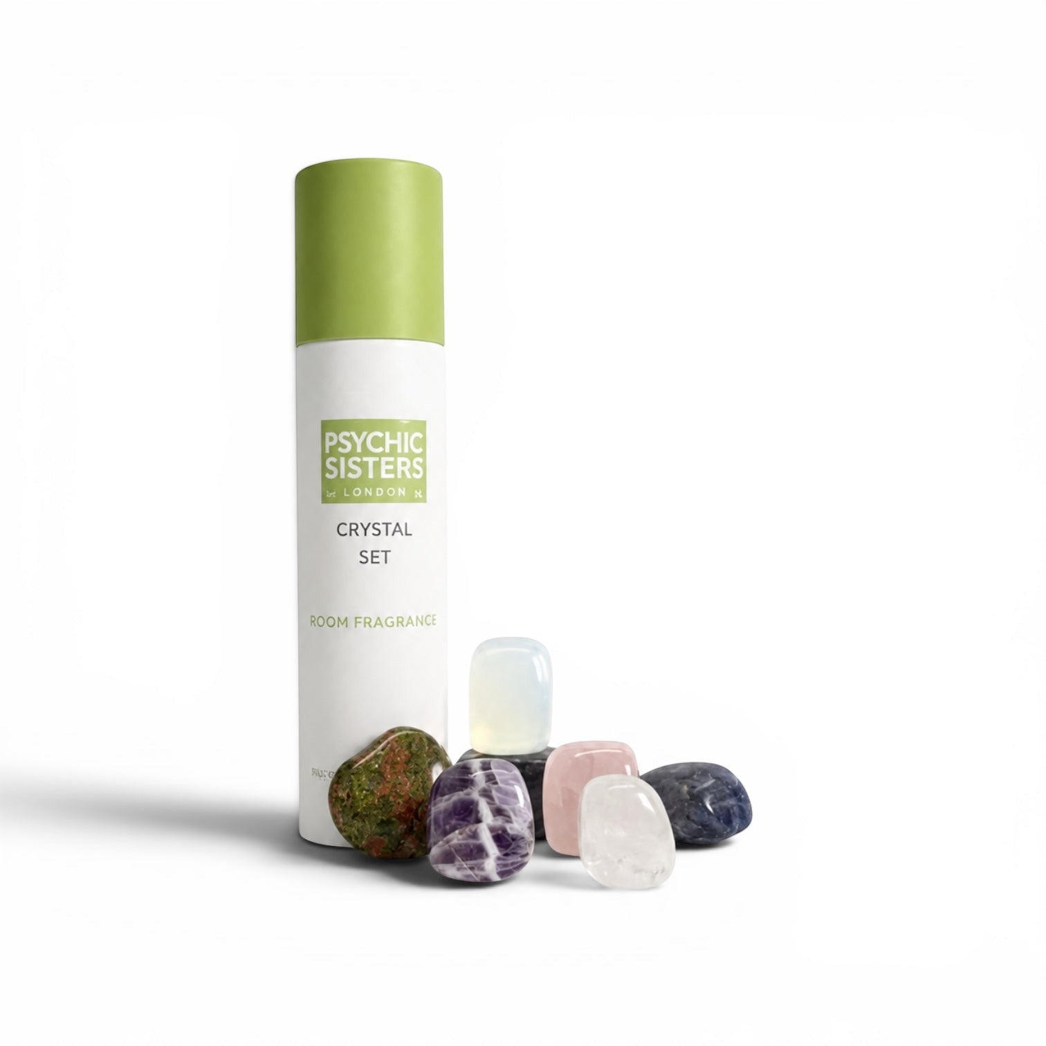 Psychic Sisters crystal set featuring seven tumbled gemstones arranged beside a white and green recycled cardboard tube.