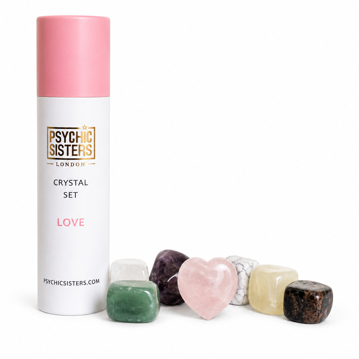 Psychic Sisters Love crystal set featuring seven assorted tumbled stones and a heart-shaped rose quartz in a tube.