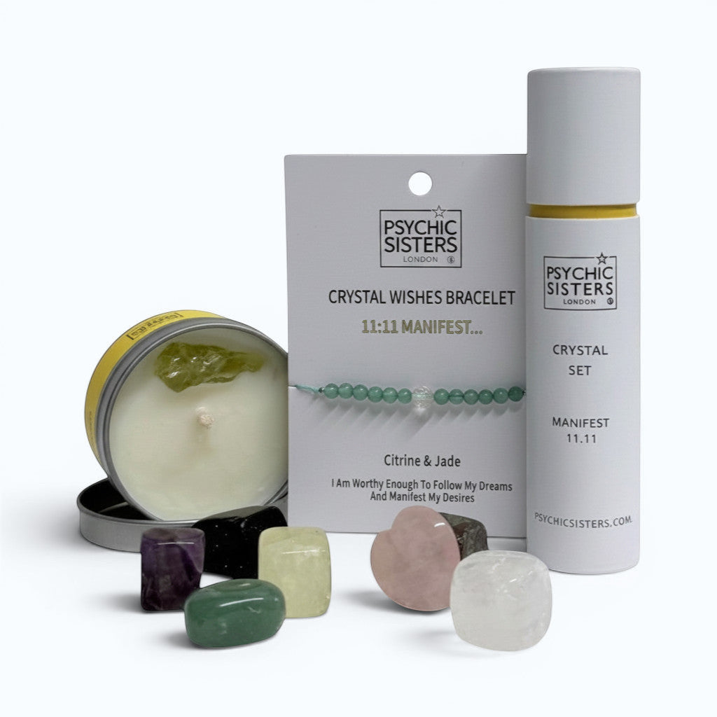 Psychic Sisters Manifest 11:11 bundle featuring a crystal bracelet, assorted tumbled stones, and a Citrine candle.