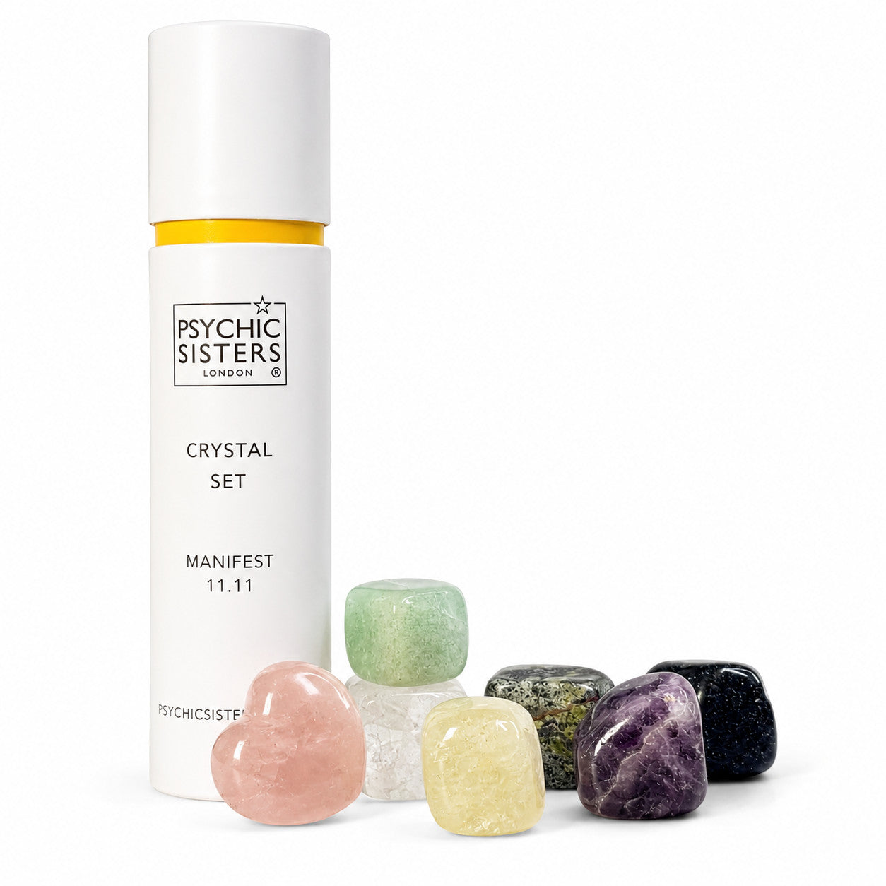 Psychic Sisters Manifest 11.11 crystal set featuring seven assorted tumbled gemstones and a white recycled cardboard tube.