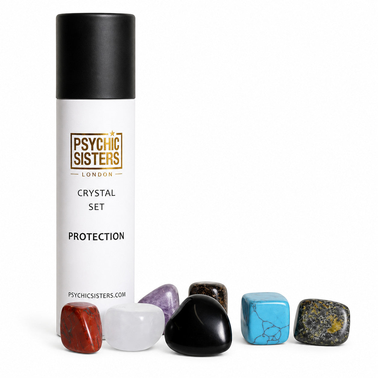 Psychic Sisters protection crystal set with seven assorted polished gemstones and a white recycled cardboard tube.