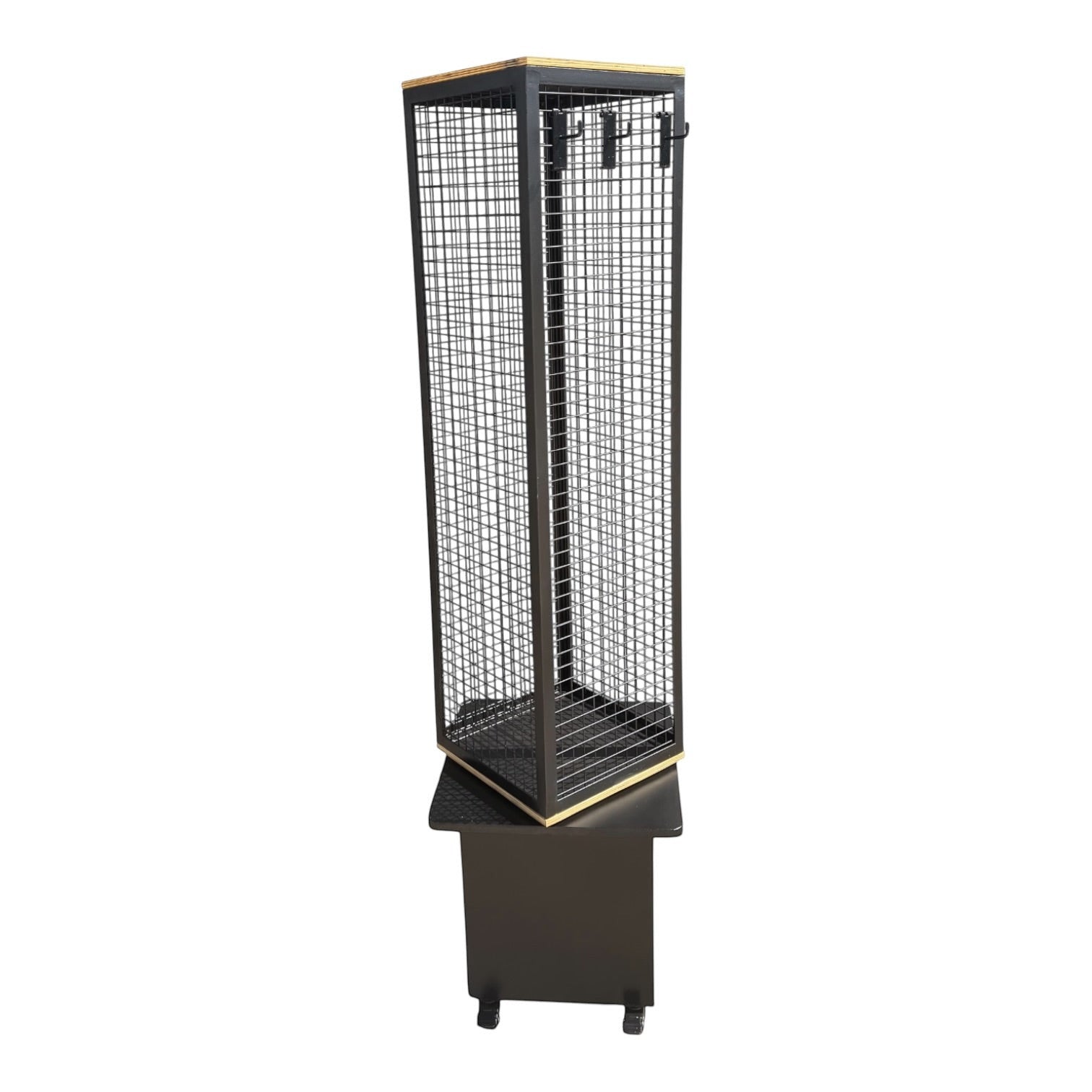Psychic Sisters 4-sided rotating black mesh spinner display stand with a sturdy base for retail merchandise.