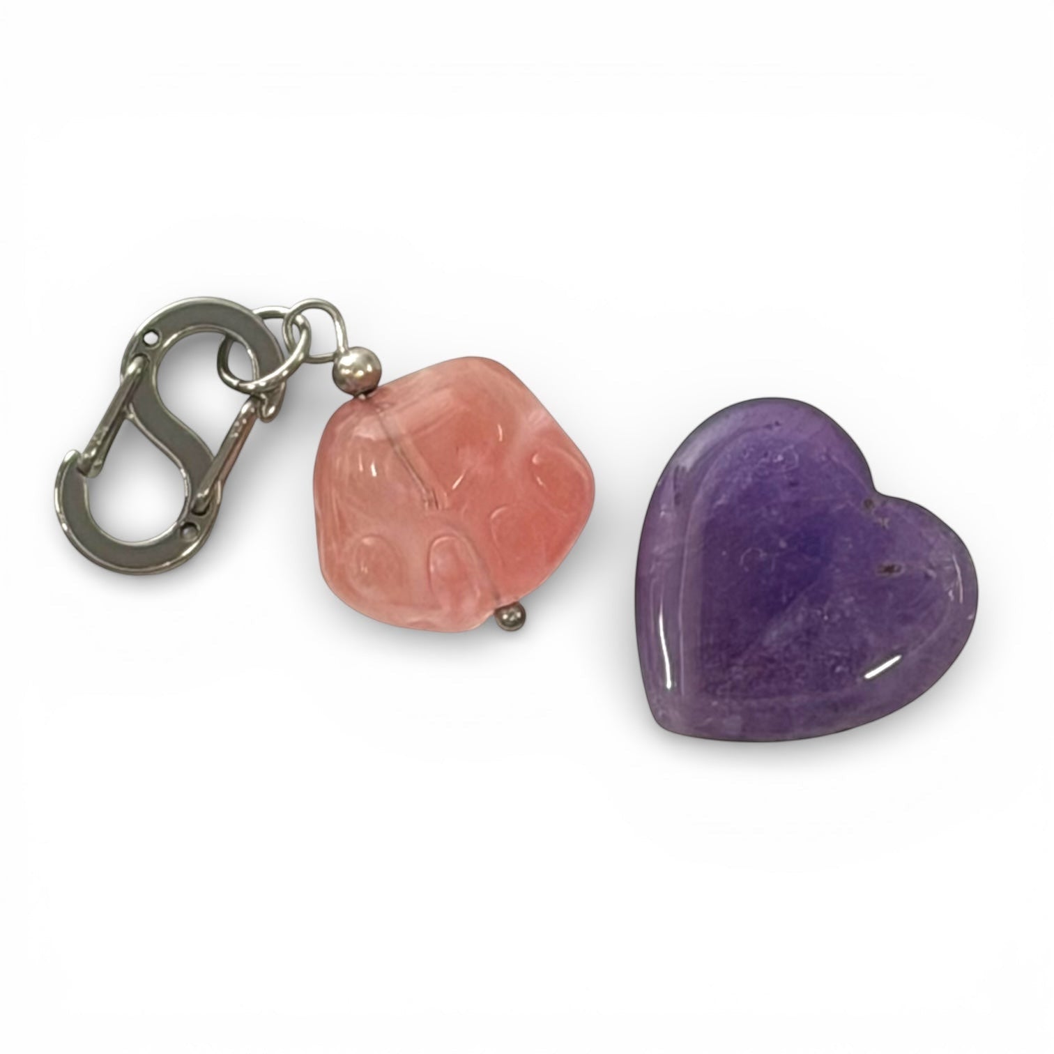 Psychic Sisters pocket hug set with a pink strawberry quartz paw charm and a purple amethyst heart crystal
