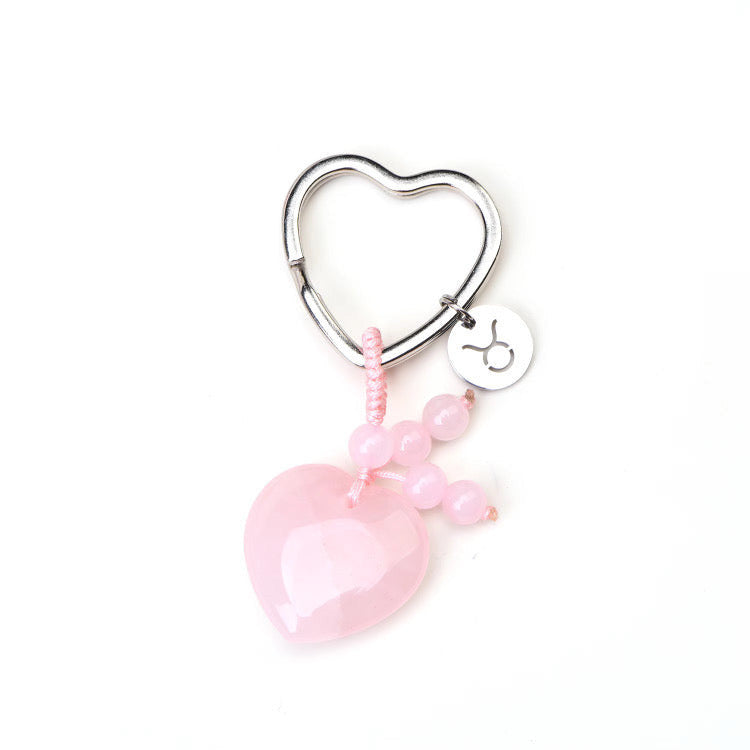 Psychic Sisters Taurus zodiac keyring featuring a pink strawberry quartz heart, beads, and a sterling silver symbol disk