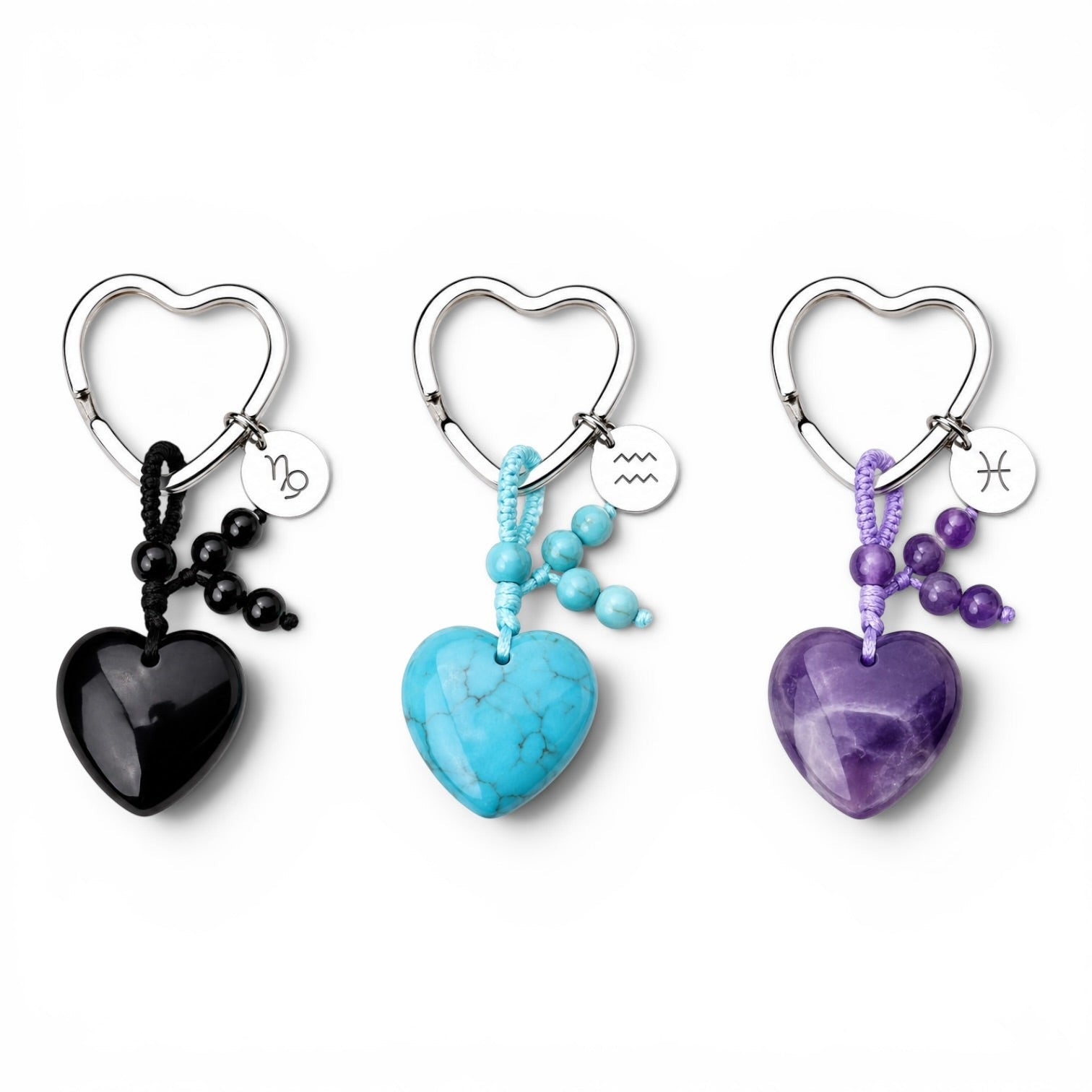 Psychic Sisters zodiac crystal keyrings with heart-shaped stones, sterling silver symbols, and beaded accents.