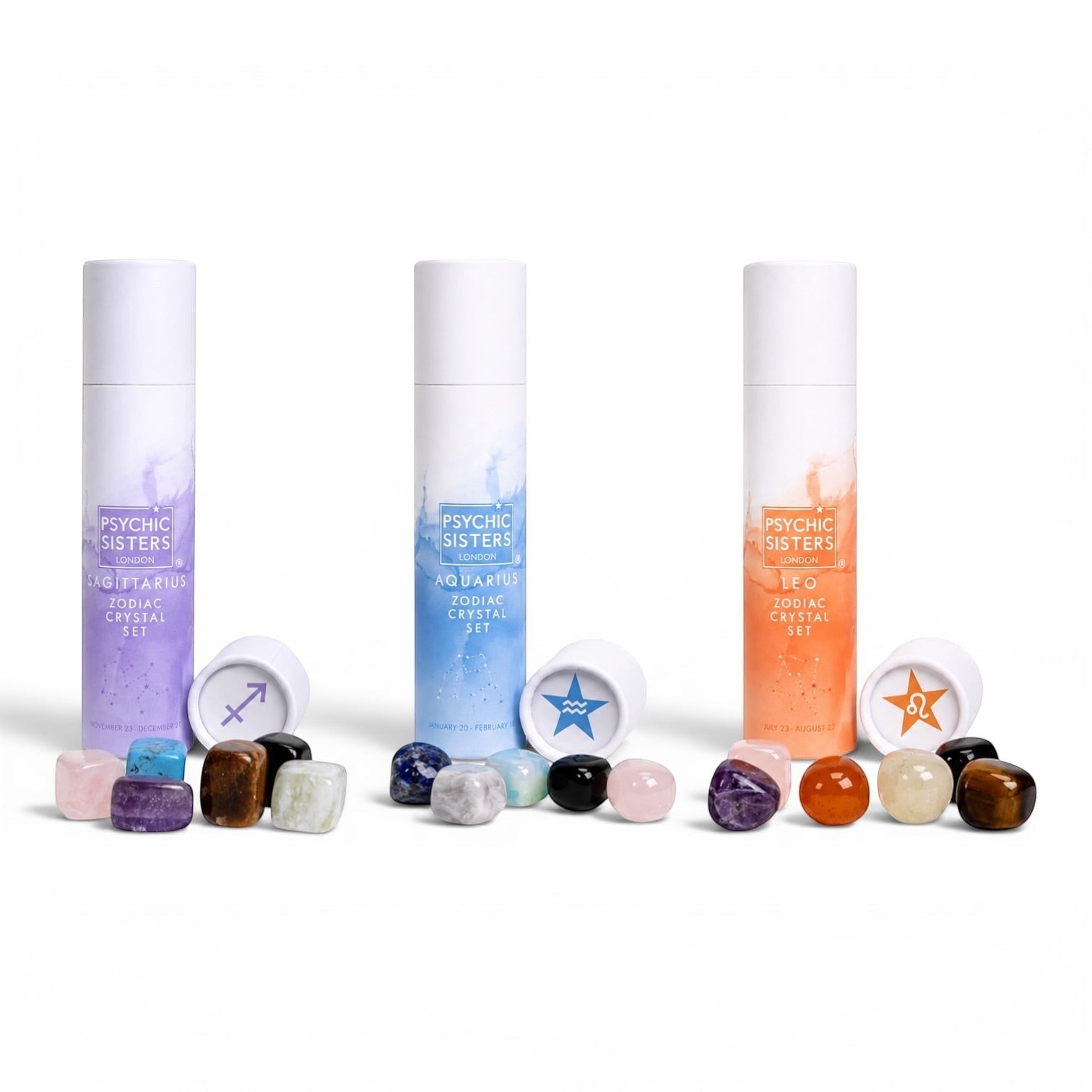 Psychic Sisters Zodiac Crystal Sets in recycled tubes with assorted tumbled gemstones for Sagittarius, Aquarius, and Leo.