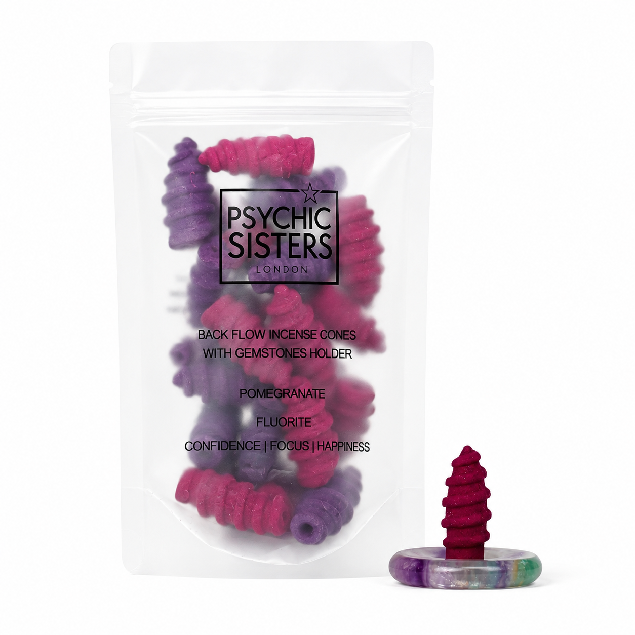 A clear stand-up pouch containing Psychic Sisters London back flow incense cones with a gemstones holder, shown on a white background with one incense cone and its holder displayed in front. The incense cones are pink and purple, and the holder has multicolor gemstone patterns.